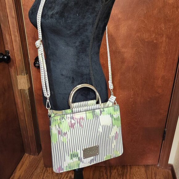 bebe Handbags - Bebe crossbody green and white stripe with silver tone handles, Zip close top.